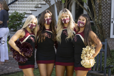 Four FSU cheerleaders pose for a photo