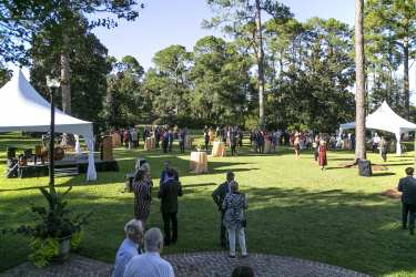 A wide view of guest talking outdoors