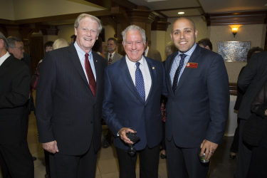 President John Thrasher and two guests smiling